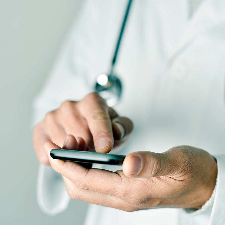 Happy doctor with thumb up, isolated on white